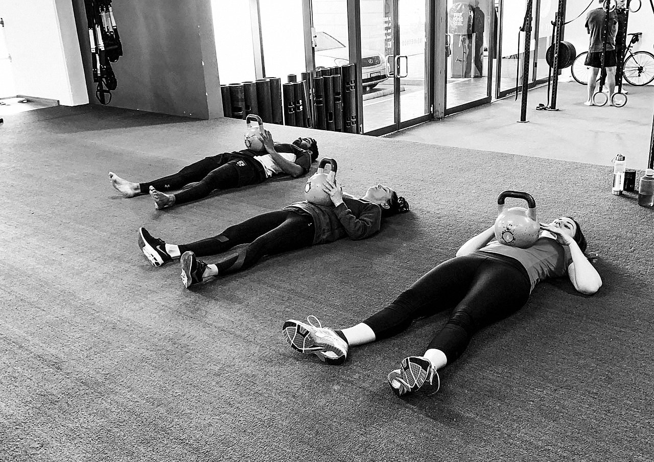 People training together on a gym floor